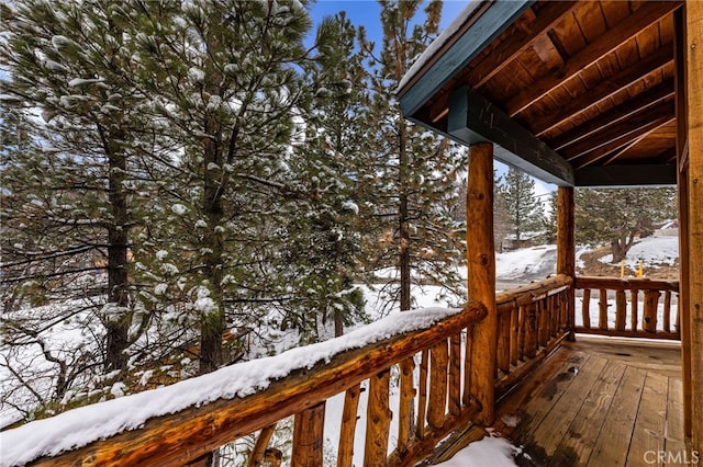 view of snow covered deck