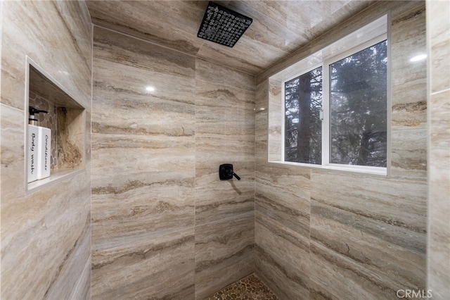 bathroom with tiled shower