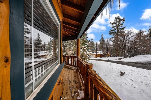 view of snow covered deck