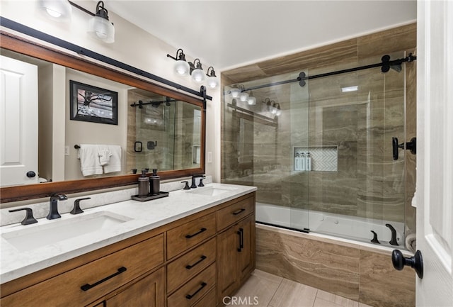 bathroom with enclosed tub / shower combo and vanity