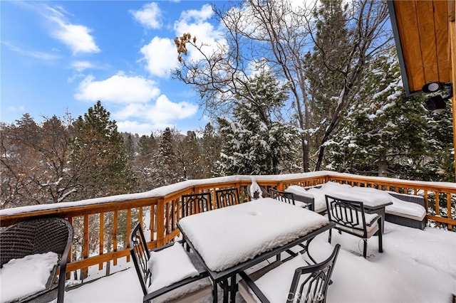 view of snow covered deck