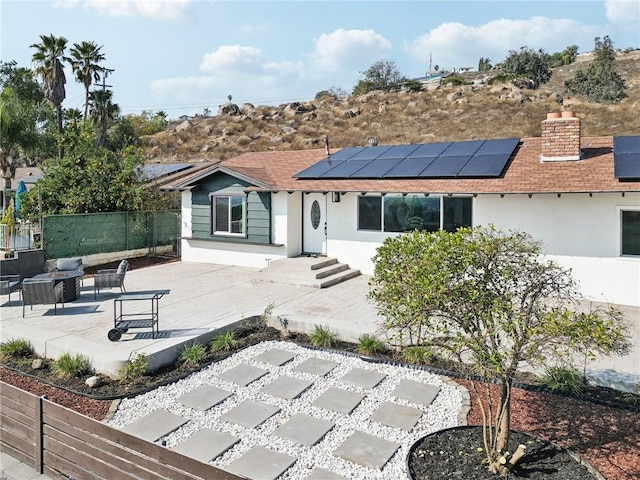 rear view of house featuring a patio