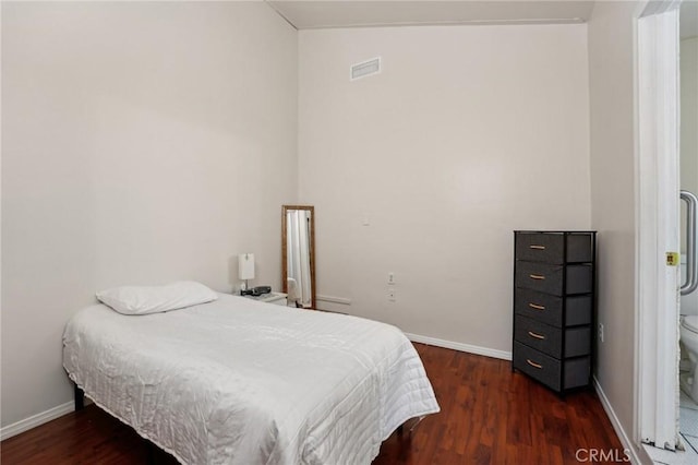 bedroom featuring dark wood-type flooring