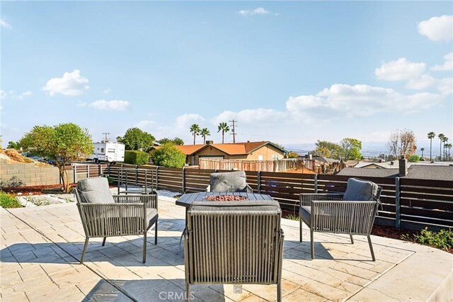 view of patio with an outdoor fire pit