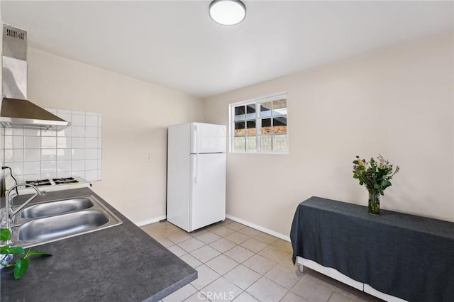 kitchen with sink, white appliances, light tile patterned floors, range hood, and decorative backsplash