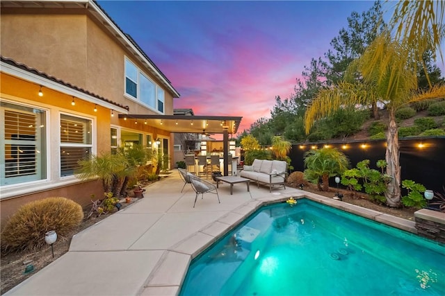 view of pool featuring a patio area and outdoor lounge area