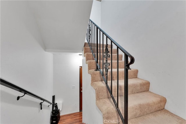 stairs with wood finished floors
