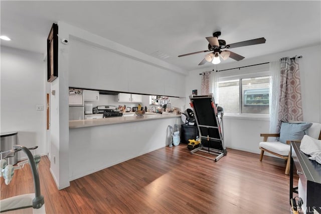 interior space featuring a ceiling fan and wood finished floors