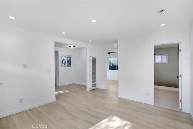 empty room with light hardwood / wood-style flooring