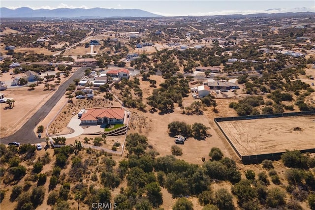 birds eye view of property featuring a mountain view