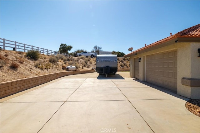 view of property exterior with a garage