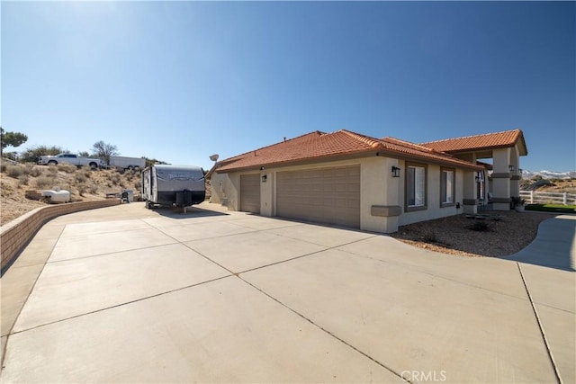 view of side of property featuring a garage