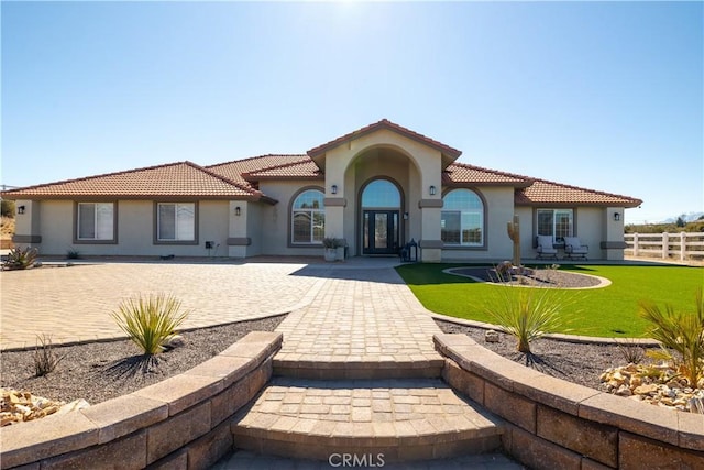 rear view of property with a yard