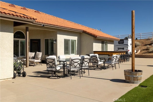 view of patio / terrace featuring an outdoor bar