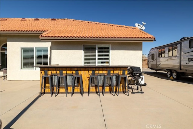 view of patio / terrace with exterior bar