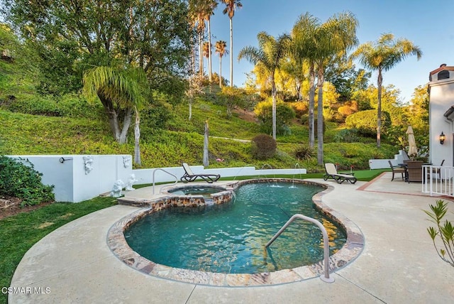 view of pool featuring an in ground hot tub and a patio area