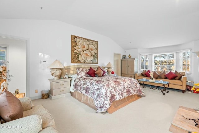 carpeted bedroom with vaulted ceiling