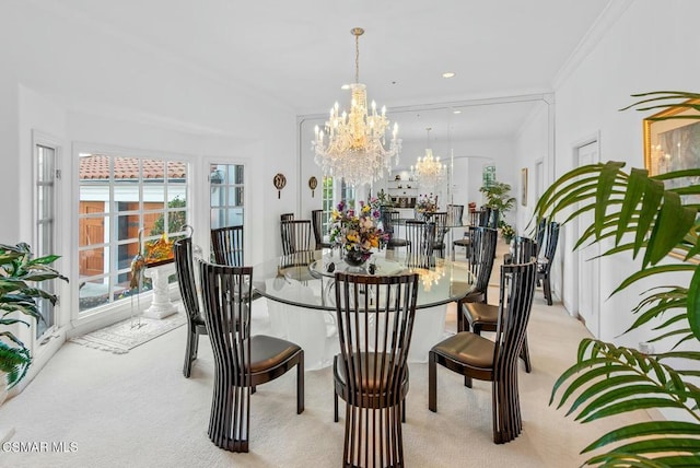 dining room featuring crown molding, a chandelier, and light carpet