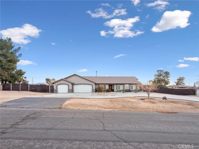 ranch-style house featuring a garage