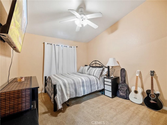 bedroom with light carpet, vaulted ceiling, and ceiling fan