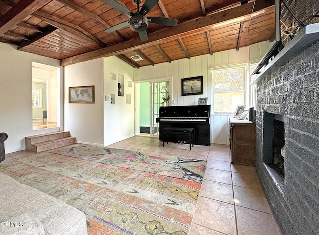 living room with wood ceiling, ceiling fan, beam ceiling, and light tile patterned flooring