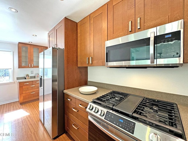 kitchen featuring appliances with stainless steel finishes and light wood-type flooring