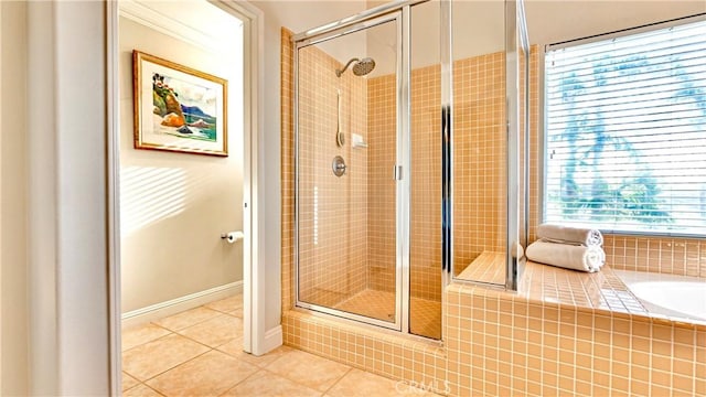 bathroom with tile patterned floors and separate shower and tub