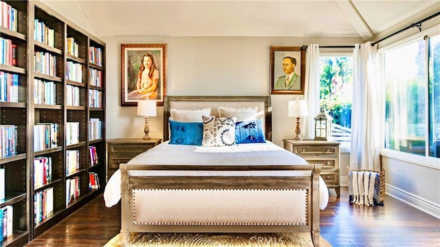 bedroom with dark hardwood / wood-style flooring