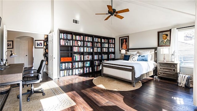 bedroom featuring multiple windows, wood-type flooring, and high vaulted ceiling