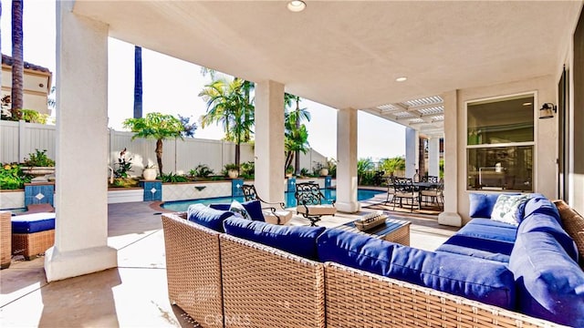 view of patio / terrace featuring a fenced in pool, a pergola, and outdoor lounge area