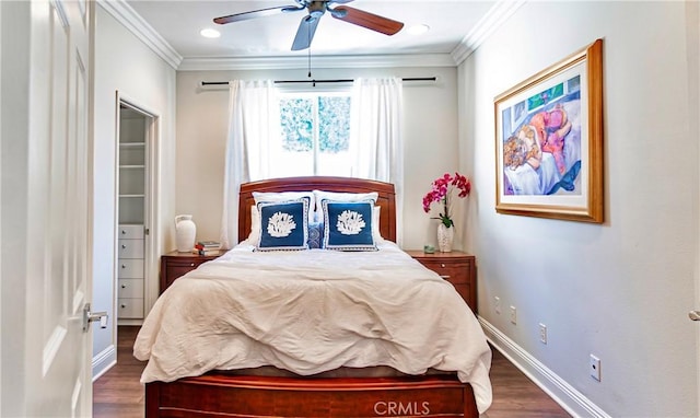 bedroom featuring dark wood-type flooring, ceiling fan, and ornamental molding