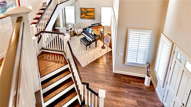 stairway featuring hardwood / wood-style floors