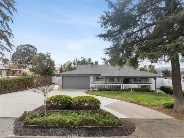 single story home with a garage and a front yard