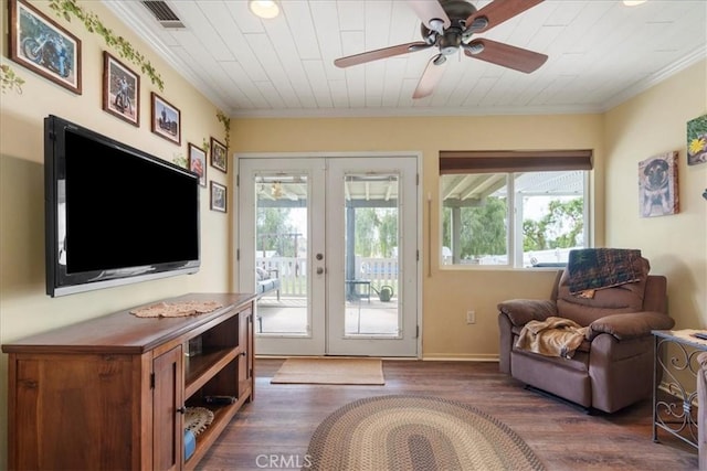 interior space featuring french doors, ceiling fan, ornamental molding, and dark hardwood / wood-style flooring