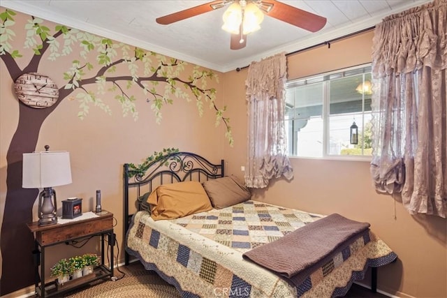 bedroom with ceiling fan and ornamental molding