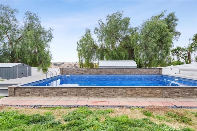 view of swimming pool featuring a storage unit