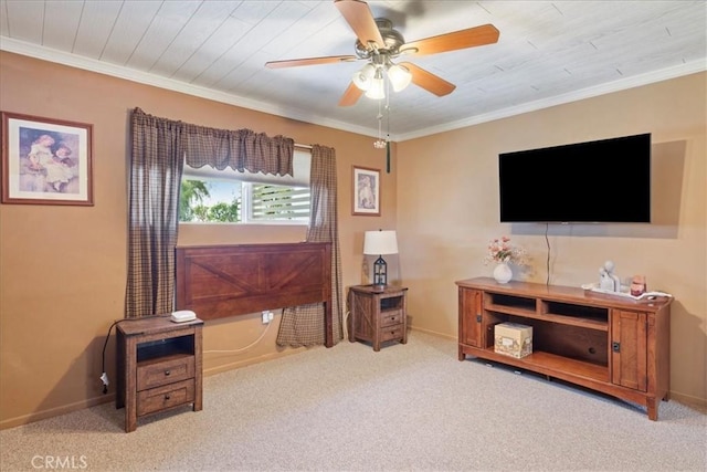 interior space featuring light colored carpet, ornamental molding, and ceiling fan