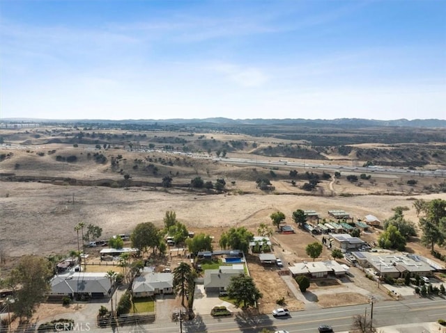 birds eye view of property featuring a mountain view