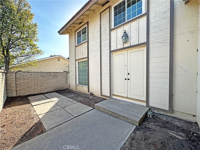 doorway to property with a patio area