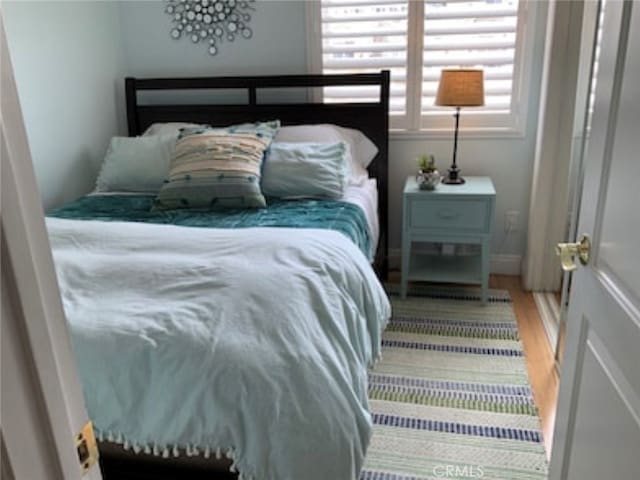 bedroom featuring hardwood / wood-style flooring