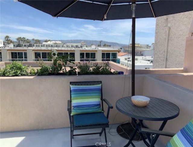 balcony featuring a mountain view