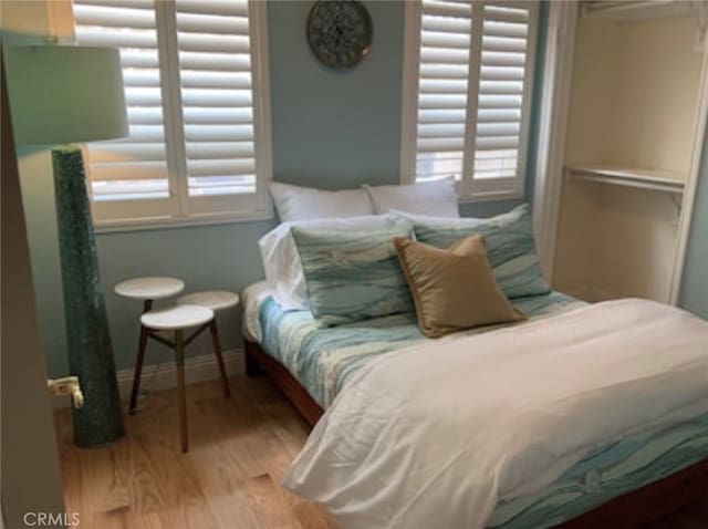 bedroom with wood-type flooring