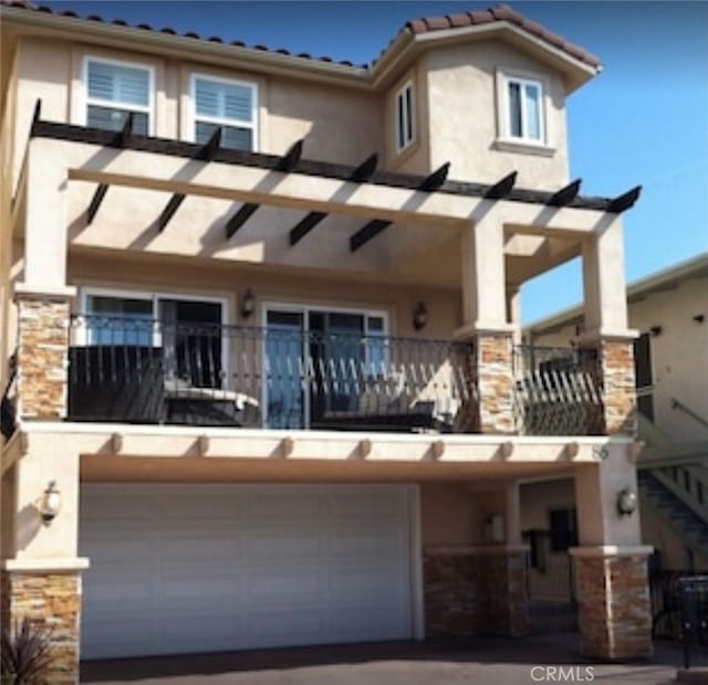 rear view of house with a garage