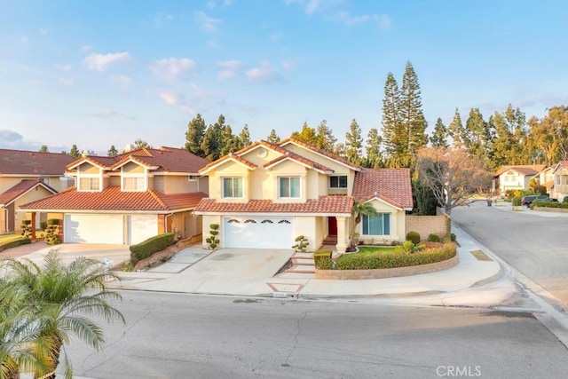 mediterranean / spanish-style house featuring a garage