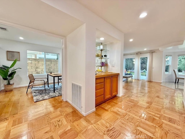 bar with light parquet flooring