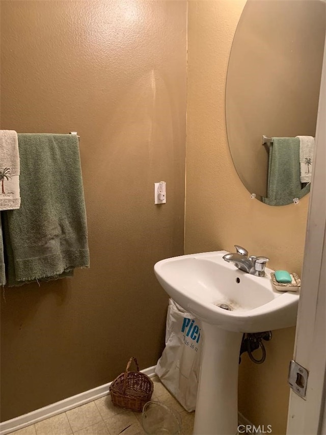 bathroom with tile patterned flooring