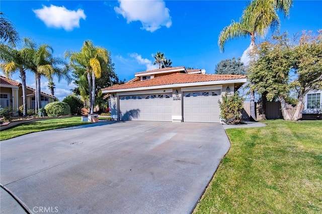 view of front of home with a garage and a front lawn