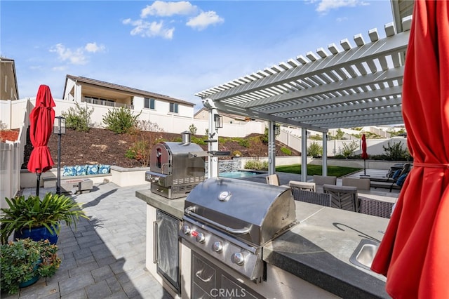 view of patio with a fenced backyard and area for grilling