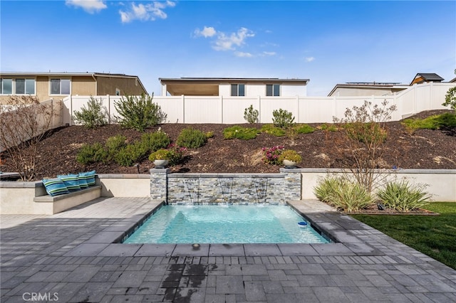 view of swimming pool featuring a fenced in pool, a patio area, and a fenced backyard