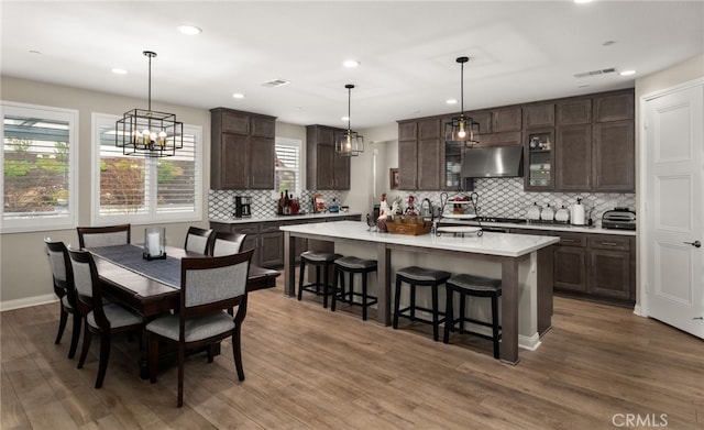 interior space with recessed lighting, visible vents, and wood finished floors